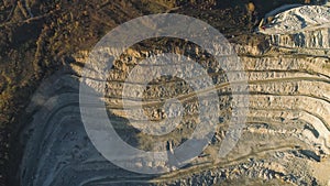 Top view of stepped quarry. Shot. Quarry working by method of open vertical benches. Mining industry concept