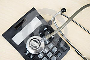 Top view of stethoscope and calculator