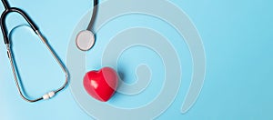 Top view Stethoscope with Red heart shape on blue background with copy space for text. Healthcare, life Insurance, Health day,