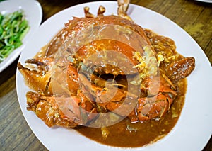 Top view of stir fried crab with curry powder and eggs. Popular Asian food especially in Thailand