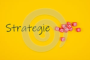 Top view of Strategie written on yellow background with red