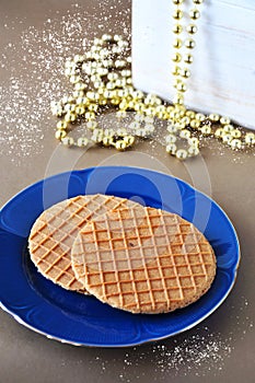 Top view of Stroopwafel Dutch waffle on Blue Dish