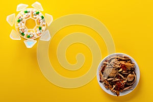 Top view studio shoot Chinese herb medicine and pills on yellow background