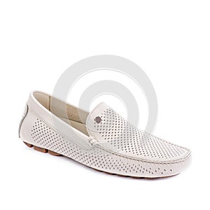 Top view of stylish ivory perforated leather men\'s moccasin shoe isolated on a white background