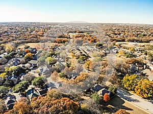 Top view subdivision neighborhood and colorful fall foliage in Flower Mound, America