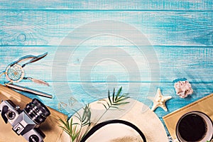 Top view of summer beach accessories on marine blue planks