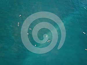 Top view of surfers in blue water