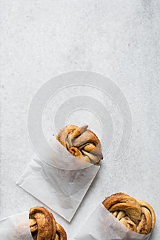 top view of Swedish cinnamon buns in a white bakery bag