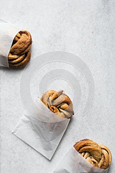 top view of Swedish cinnamon buns in a white bakery bag