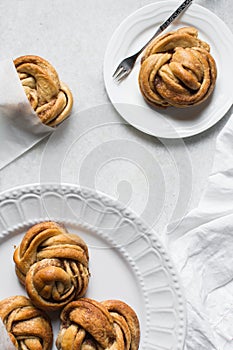 top view of Swedish cinnamon buns in a white bakery bag