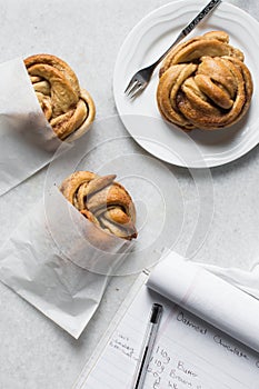 top view of Swedish cinnamon buns in a white bakery bag