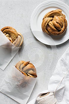 top view of Swedish cinnamon buns in a white bakery bag