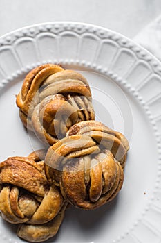 top view of Swedish cinnamon buns on a white plate