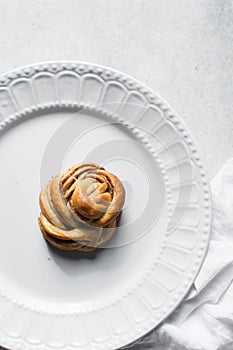top view of Swedish cinnamon buns on a white plate