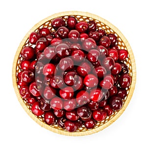 Top view of sweet cherry berries (Prunus avium) in wicker plate