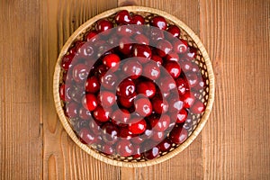 Top view of sweet cherry berries (Prunus avium) in wicker plate