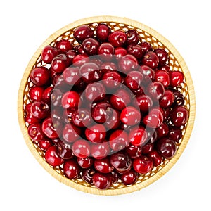 Top view of sweet cherry berries (Prunus avium) in wicker plate photo