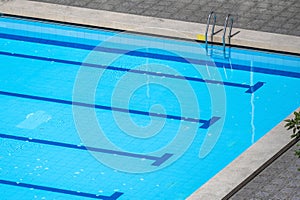 Top view swimming pool magnificent swimming pool comes into view, blue lanes stretching across its surface provide swimmers with