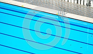 Top view swimming pool magnificent swimming pool comes into view, blue lanes stretching across its surface provide swimmers with