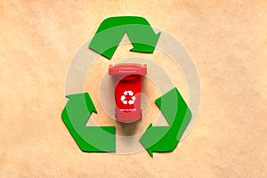 Top view of Symbol of recycling with red recycle bin. Eco friendly recycling concept