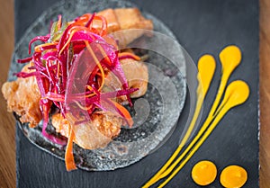 Top view of Tacos Gobernador served on black corn tortilla photo