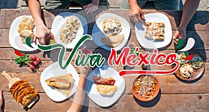 Top view of tacos, tamal, enchilada, pozole with the phrase viva mexico