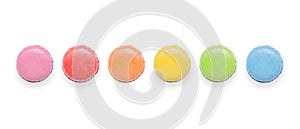 Top view of tasty colorful macaroons on white background.