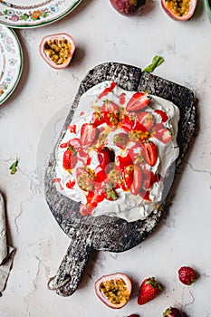 top view of tasty strawberry and passion fruit meringue cake