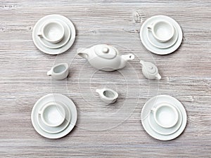 Top view of tea set on gray brown table