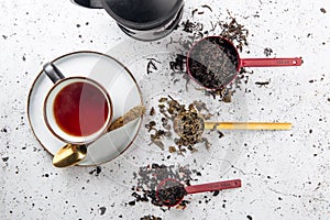 Top view on tea set with spoons and a cup