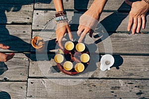 Top view tea set a wooden table for tea ceremony background. Woman and man holding a cup of tea