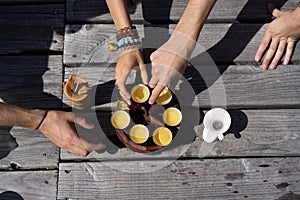 Top view tea set a wooden table for tea ceremony background. Woman and man holding a cup of tea