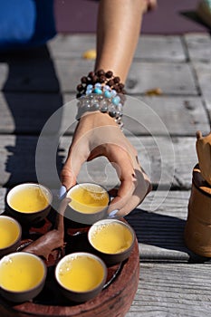 Top view tea set a wooden table for tea ceremony background. Woman and man holding a cup of tea