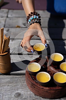 Top view tea set a wooden table for tea ceremony background. Woman and man holding a cup of tea