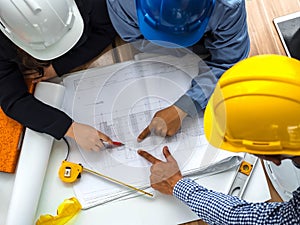 Top view teamwork concept, Engineer and workers discussing project of new building. ,Team of architects Asian people in group on