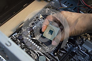 top view technician inserting cpu, computer assembler