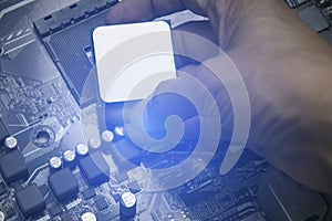 Top view of technician installing CPU chip on motherboard, CPU chip It& x27;s the brain part of the computer