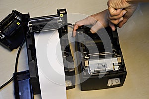 Top view. Technician repairing printer, thermal printer