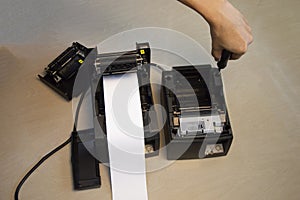 Top view. Technician repairing printer, thermal printer