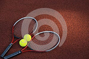 Tennis ball, racquet on hard court surface