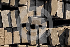 Texture background of randomly scattered grey building bricks