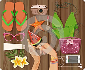 Top view with textured table and summer set, swimsuit, starfish, camera