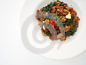 Top view of Thai local traditional food: stir fried crispy duck chopped meat with holy basil