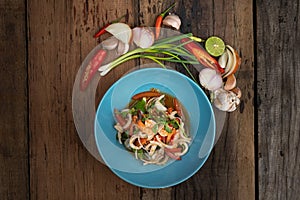 Top view of Thai spicy seafood salad with prawns, squid and Thai mussels