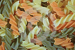 Top View of Three-Color Spiral Shaped Pasta Fusilli, for Background