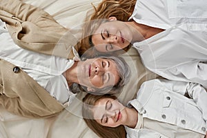 Top view of three generations of women sleeping