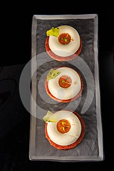 Top view on three shortbread cookies with white mousse cream