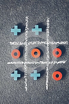 Top view of tic tac toe game on dark background