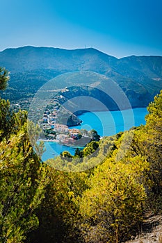 Top view to Assos village Kefalonia. Greece. Beautiful turquoise colored bay lagoon water surrounded by pine and cypress