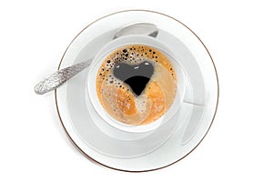 Top view to cup of fresh brewed espresso with creama in form of